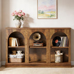 Rustic brown wooden console table with three arched shelves, featuring decor like a vintage record player and books.