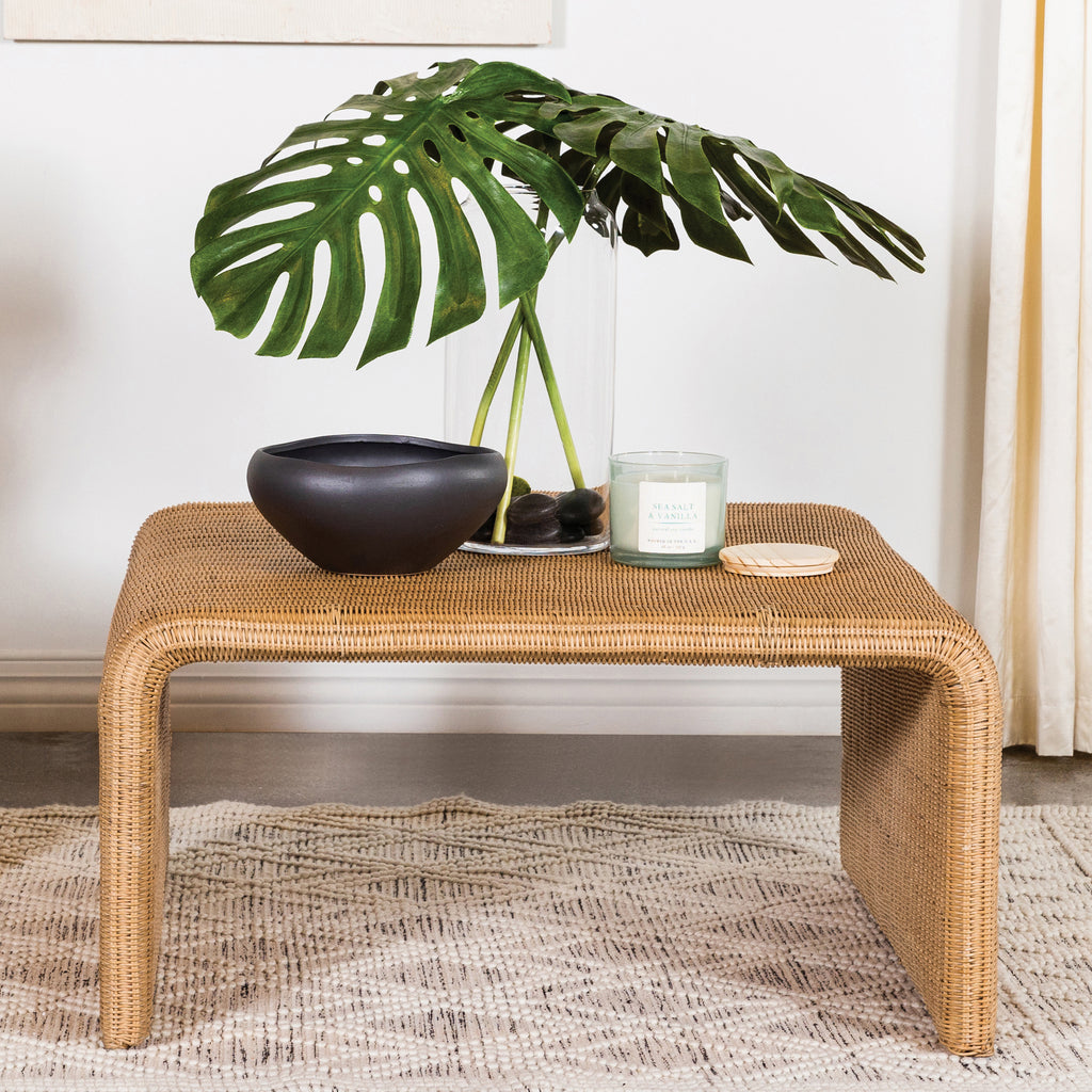 Natural Square Woven Rattan Coffee Table styled with decor, showcasing its spacious top and natural finish for modern interiors.