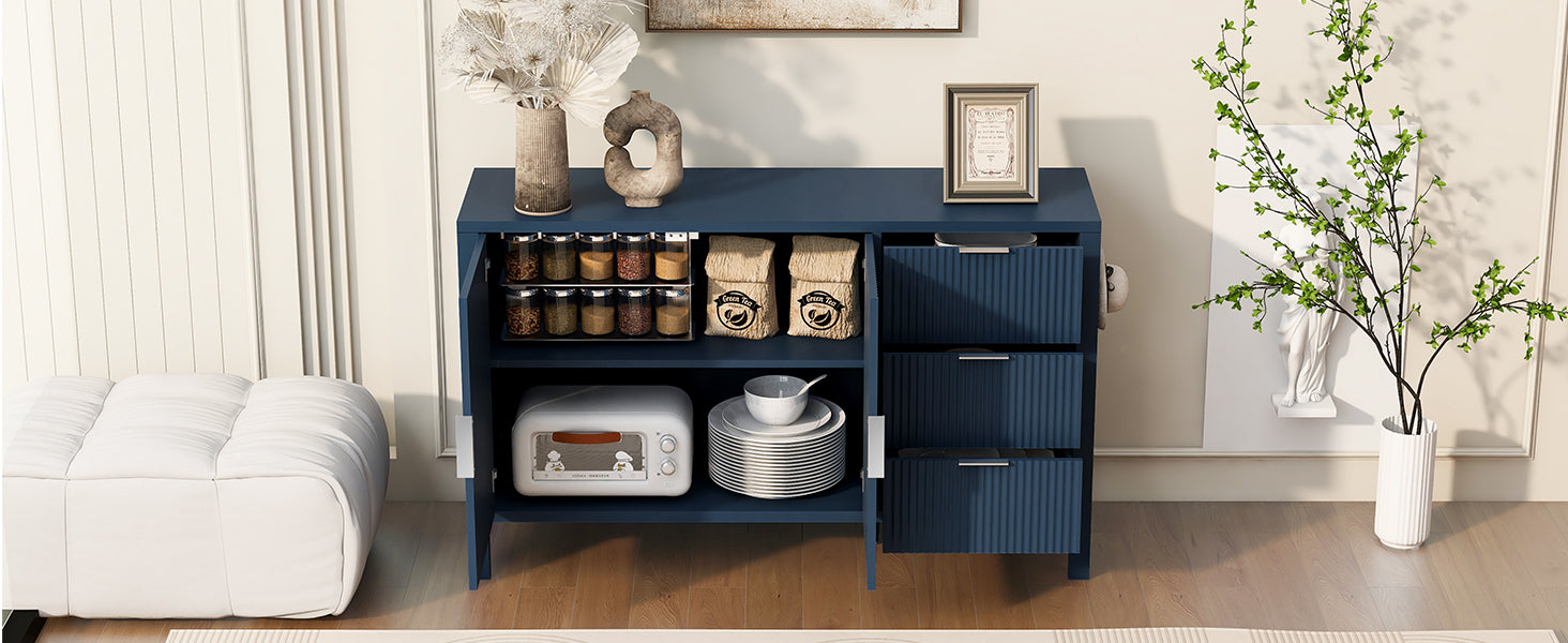 Interior view of navy sideboard with open doors and drawers, displaying ample storage for jars, dishes, and pantry items.