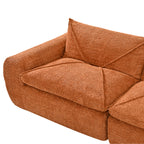 Close-up of 116'' compressed sofa no assembly armrest and cushion in textured burnt orange chenille fabric with plush padding.