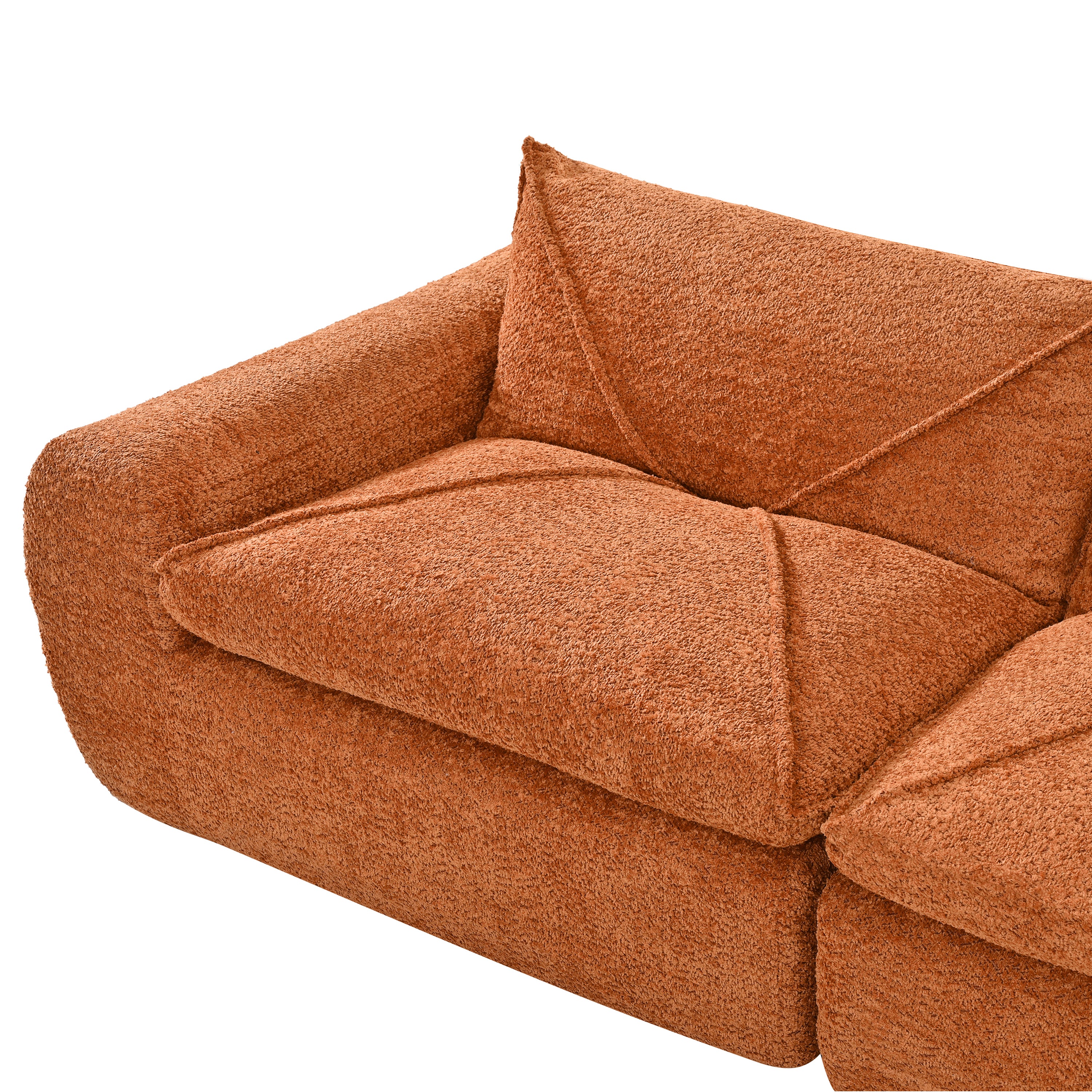 Close-up of 116'' compressed sofa no assembly armrest and cushion in textured burnt orange chenille fabric with plush padding.