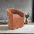Contemporary barrel-back accent chair in rustic orange textured fabric on a neutral area rug.