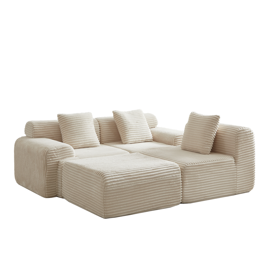 Angled view of modular corduroy sofa in cream with plush cushions. 114-inch sectional offers customizable seating without assembly.