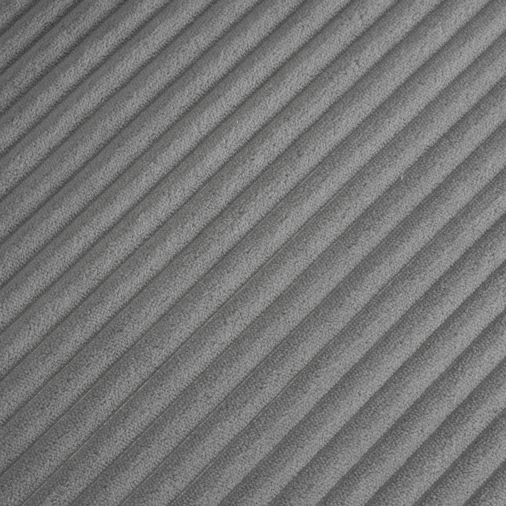 Close-up of dark grey corduroy fabric texture on modular sofa, highlighting its soft, ribbed surface for a cozy modern look.