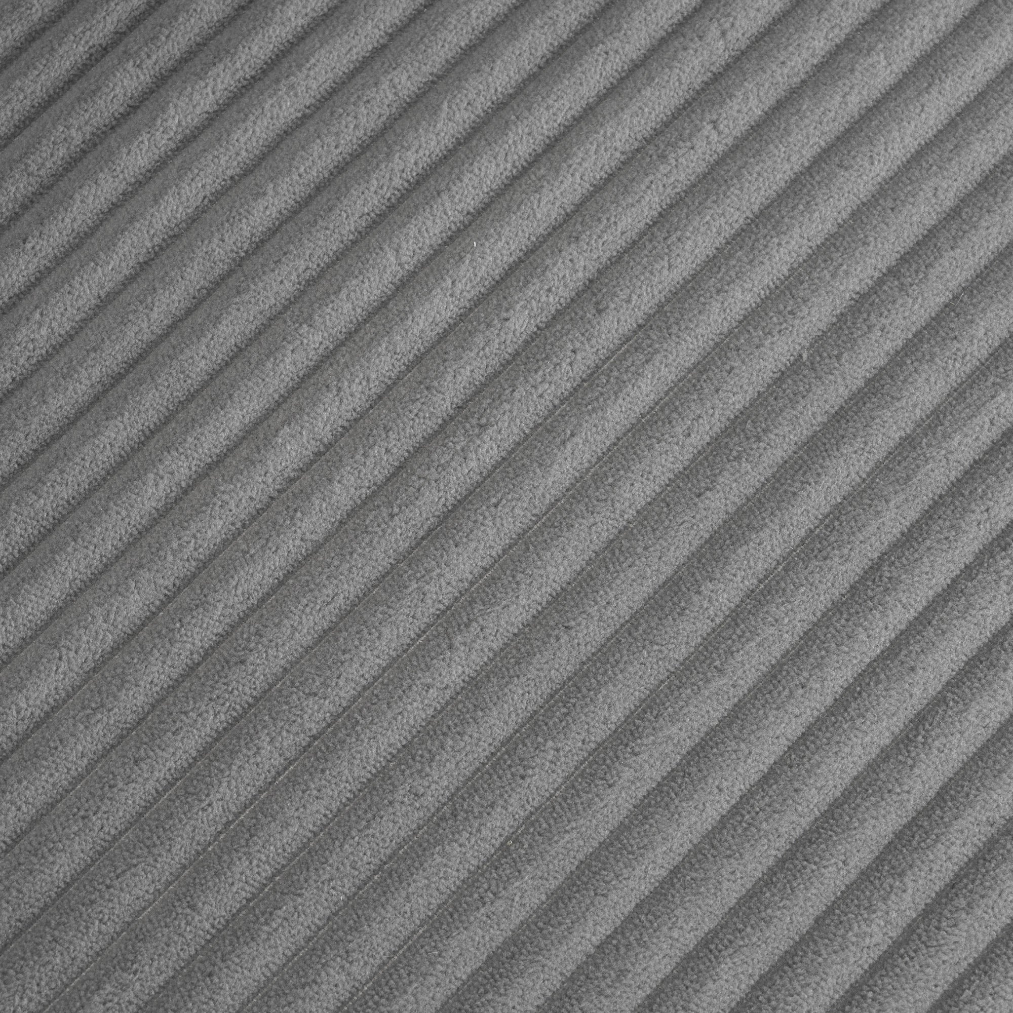 Close-up of dark grey corduroy fabric texture on modular sofa, highlighting its soft, ribbed surface for a cozy modern look.