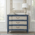 Three-drawer bachelor chest in serene ocean blue with textured beige drawer fronts and antique brass pull handles.