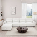 Beige modular L-shaped sectional sofa with storage ottoman, USB port, and spring pack cushions in a modern living room.