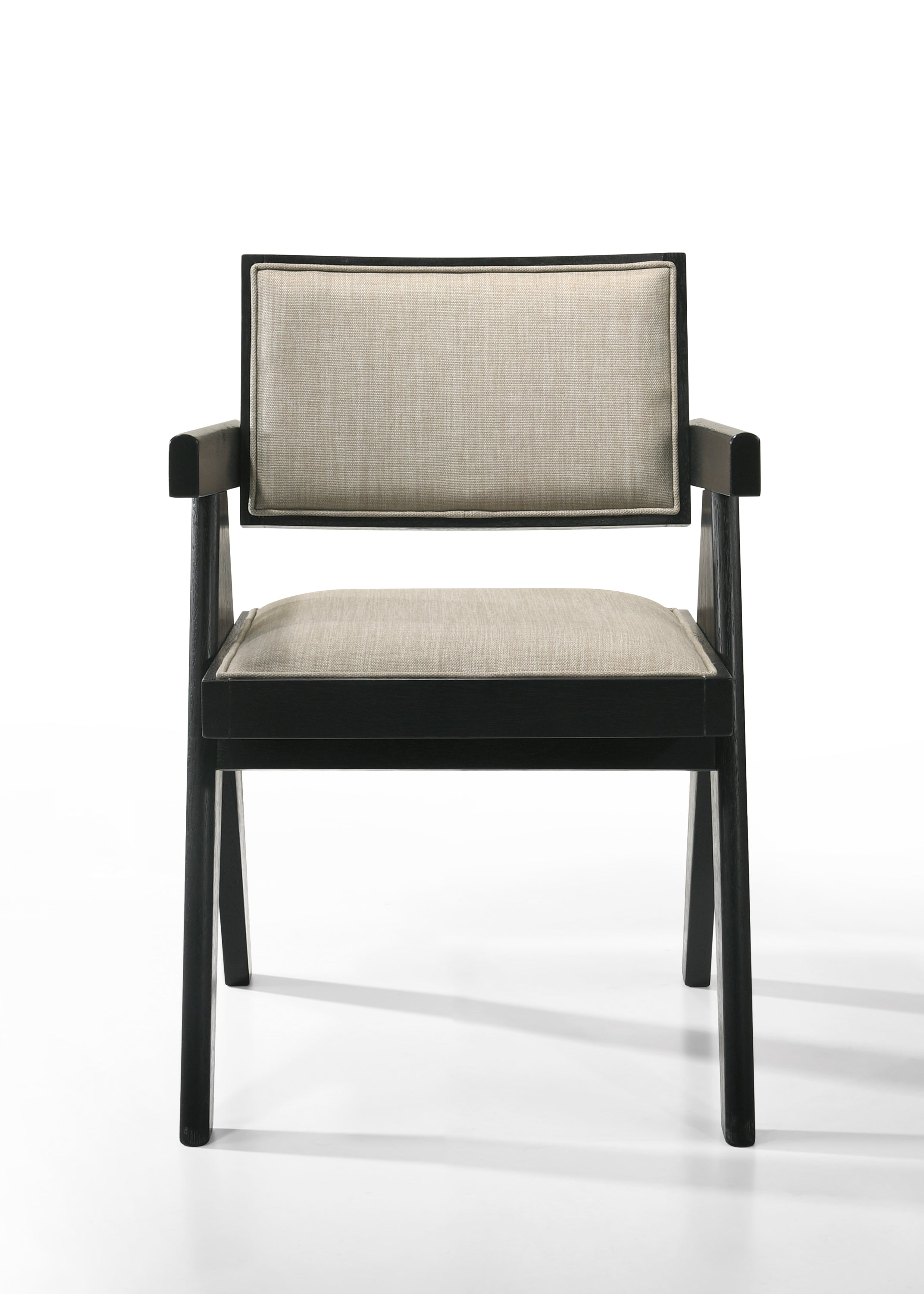 Front view of Jasper dining chair with beige fabric seat and backrest. Ebony black wood frame adds contrast and elegance.
