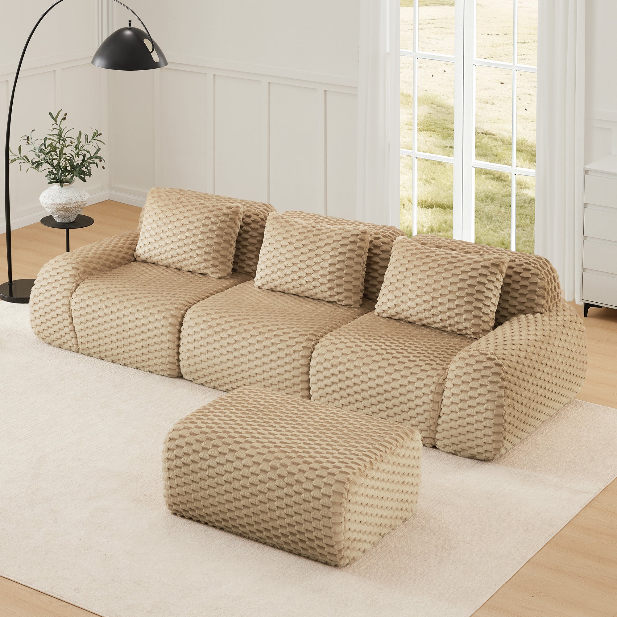 Top view of L-Shaped Modular Sectional Sofa - Light Camel with matching ottoman, showcasing its modular and flexible layout.