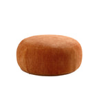 Round orange ottoman matching the 134.63'' oversized L-shape sectional sofa, ideal for extra seating or footrest.