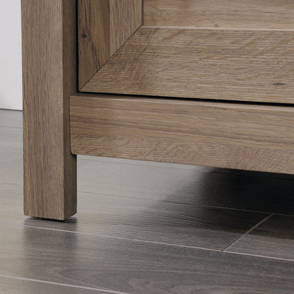 Bottom corner of the brown dresser showing sturdy leg construction and wood texture, suitable for bedroom storage.
