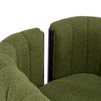 Detail of the backrest and armrest connection on a modern olive green dining chair with black wood frame.