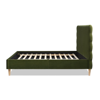 Side profile of the Stockholm Modern Platform Bed in queen size with olive green velvet frame and wavy headboard design.