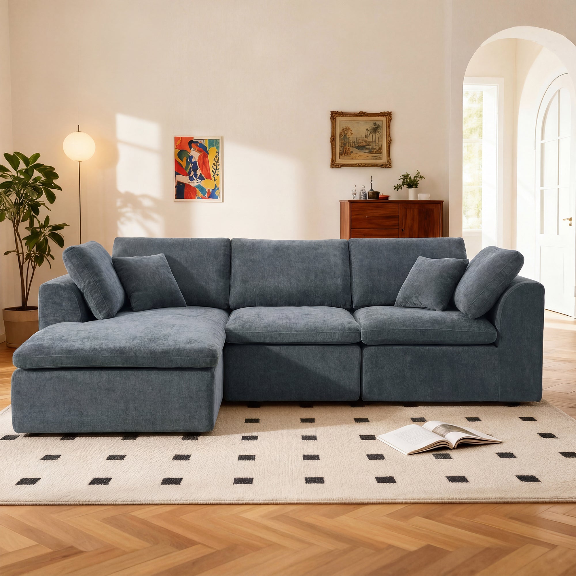L-shaped sectional sofa with chaise in blue chenille, featuring plush cushions and modular design, perfect for contemporary living rooms.