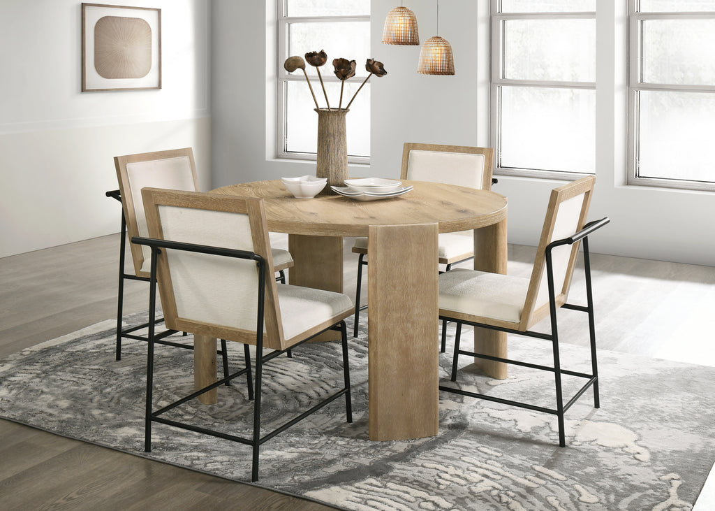 Bowen Oak Dining Table Set - Cream Chairs in bright dining space. Round oak table with four upholstered chairs, perfect for contemporary homes.