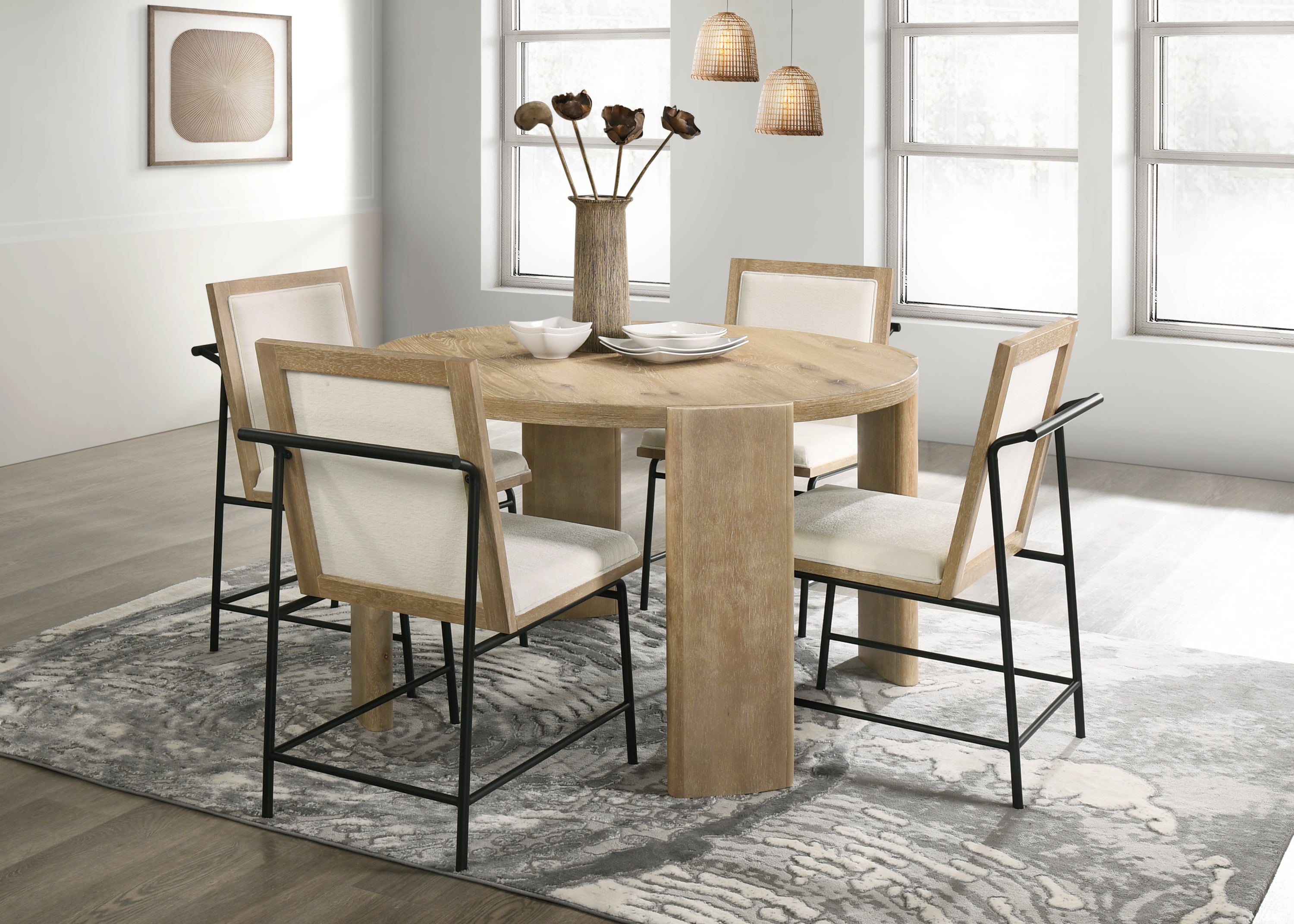 Bowen Oak Dining Table Set - Cream Chairs in bright dining space. Round oak table with four upholstered chairs, perfect for contemporary homes.