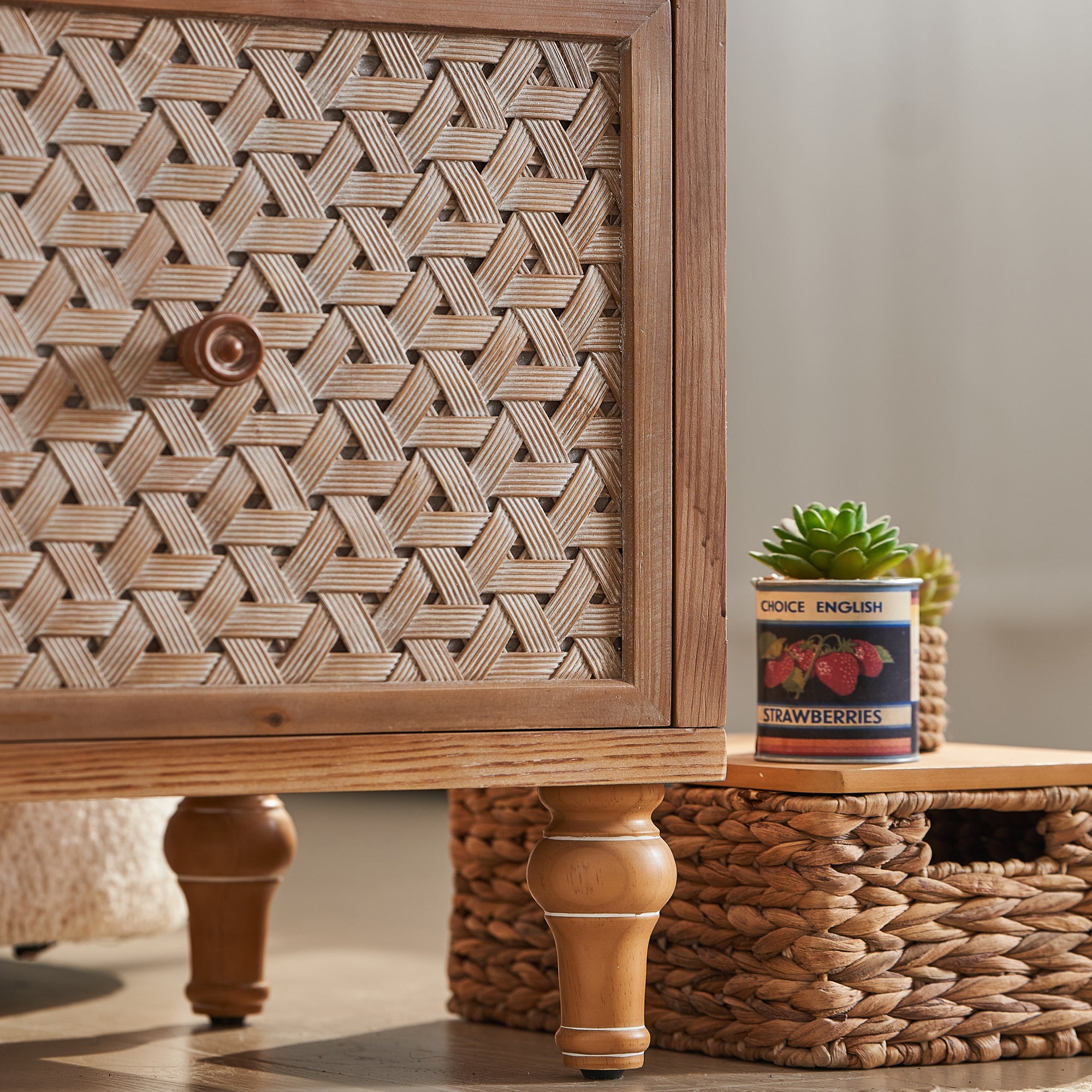 Close-up of boho rattan door texture and turned wooden legs on the Mid Century TV Stand with Storage for stylish interiors.