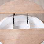 Top-down view of open lift-top round coffee table showing internal storage and white carved base.