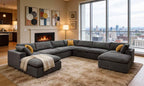 U-shaped grey modular sectional sofa with textured upholstery, accent pillows, and a cream throw in a modern living room.
