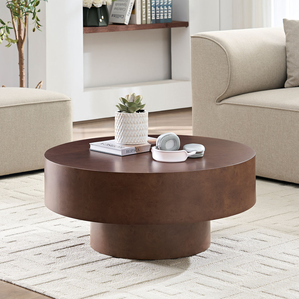 Round Faux Burl Coffee Table with pedestal base in a cozy beige living room, showcasing its compact and elegant design.