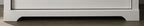 Elara White 4-Drawer Chest with Black Metal Handles.