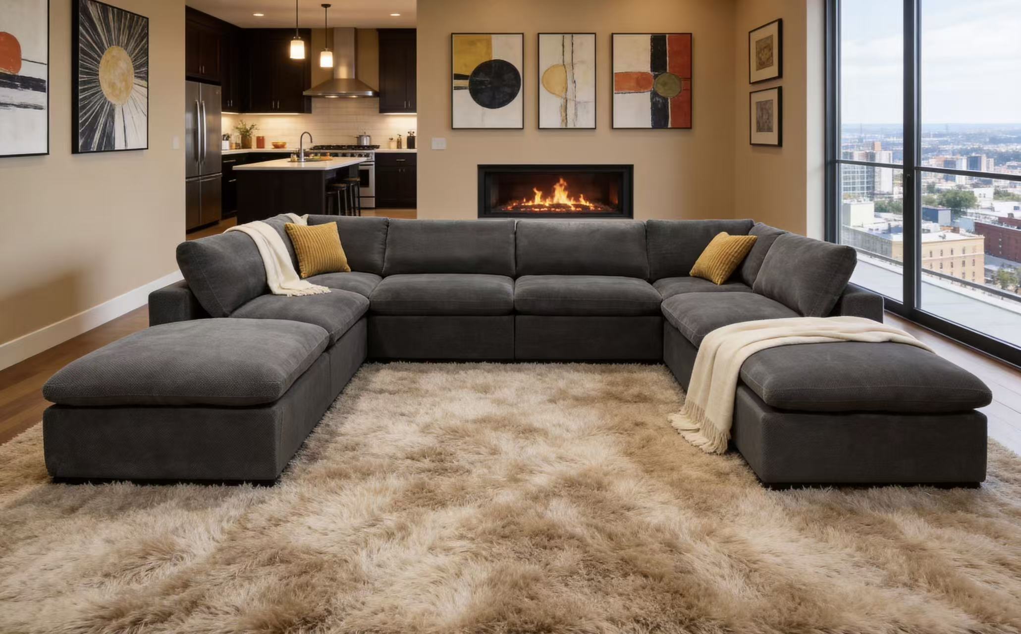 U-shaped charcoal gray modular sectional sofa in textured fabric with two chaise ends and mustard yellow throw pillows.