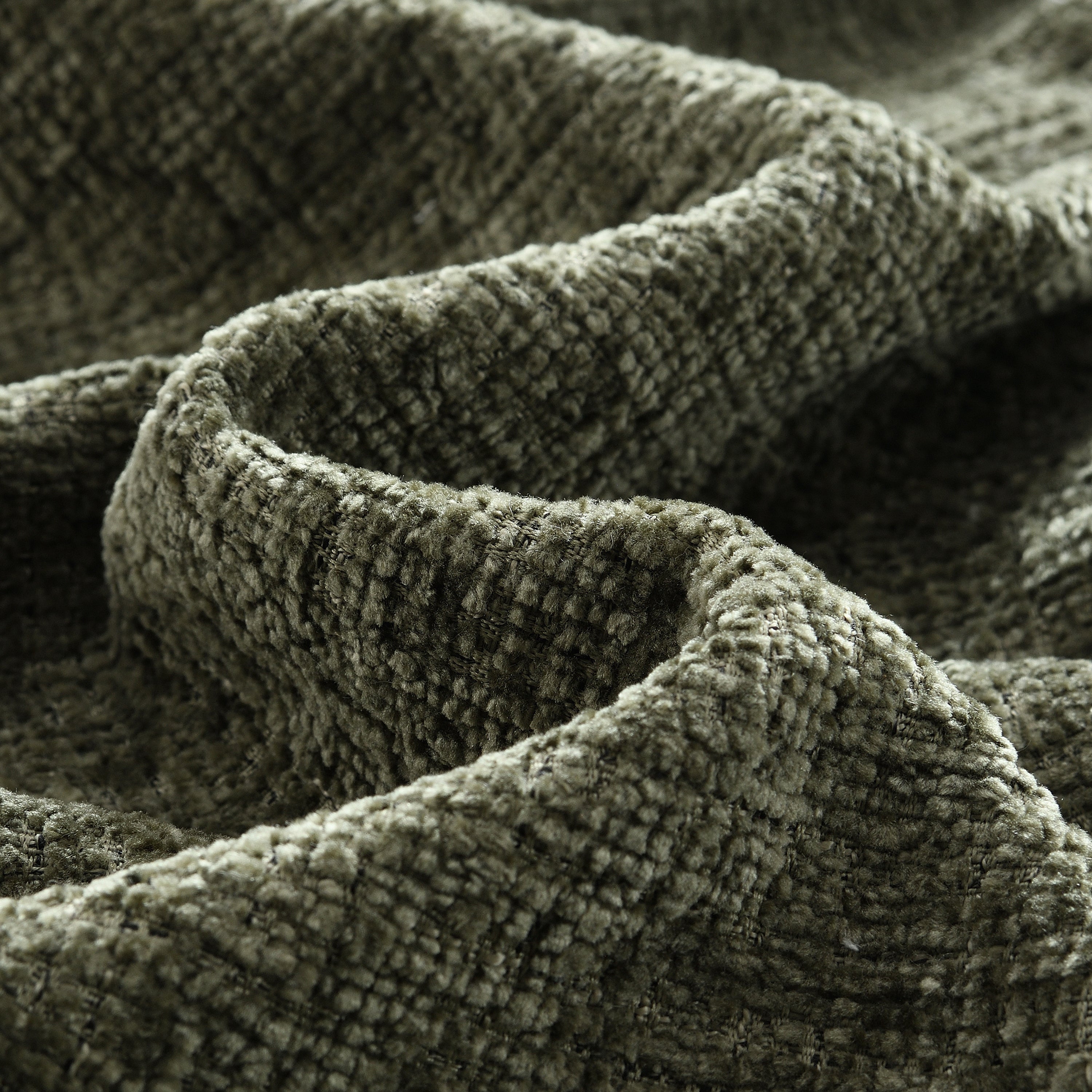 Close-up of soft chenille fabric texture used in the Modular Sectional Sofa, emphasizing its luxurious and durable upholstery.