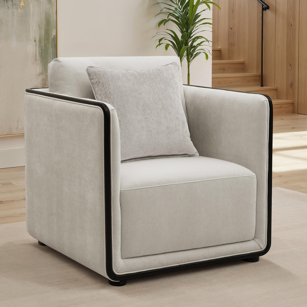Contemporary taupe accent chair with high-density foam, black trim detailing, and a matching back pillow.