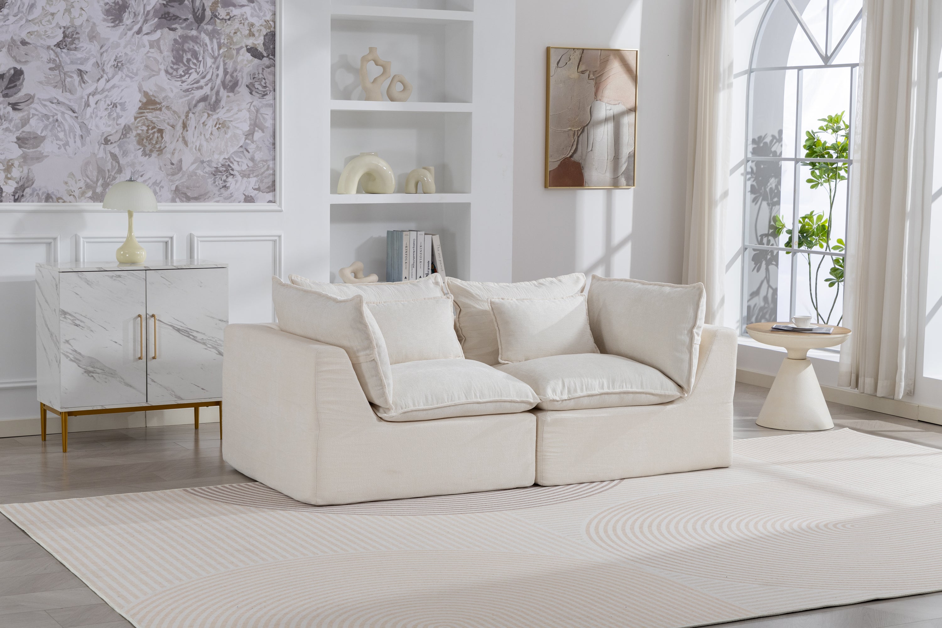 Modular sectional sofa in oversized design with velvet finish, placed in a modern living room with neutral tones and natural lighting.