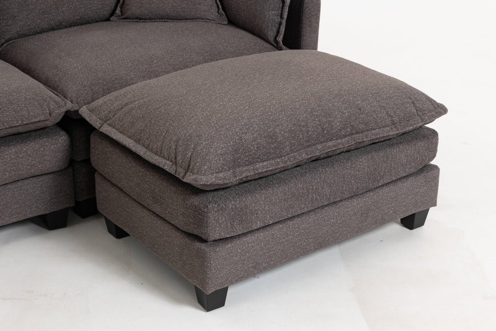 Ottoman from Sectional Sofa set shown separately. Features plush top cushion and solid wood legs for added stability and style.