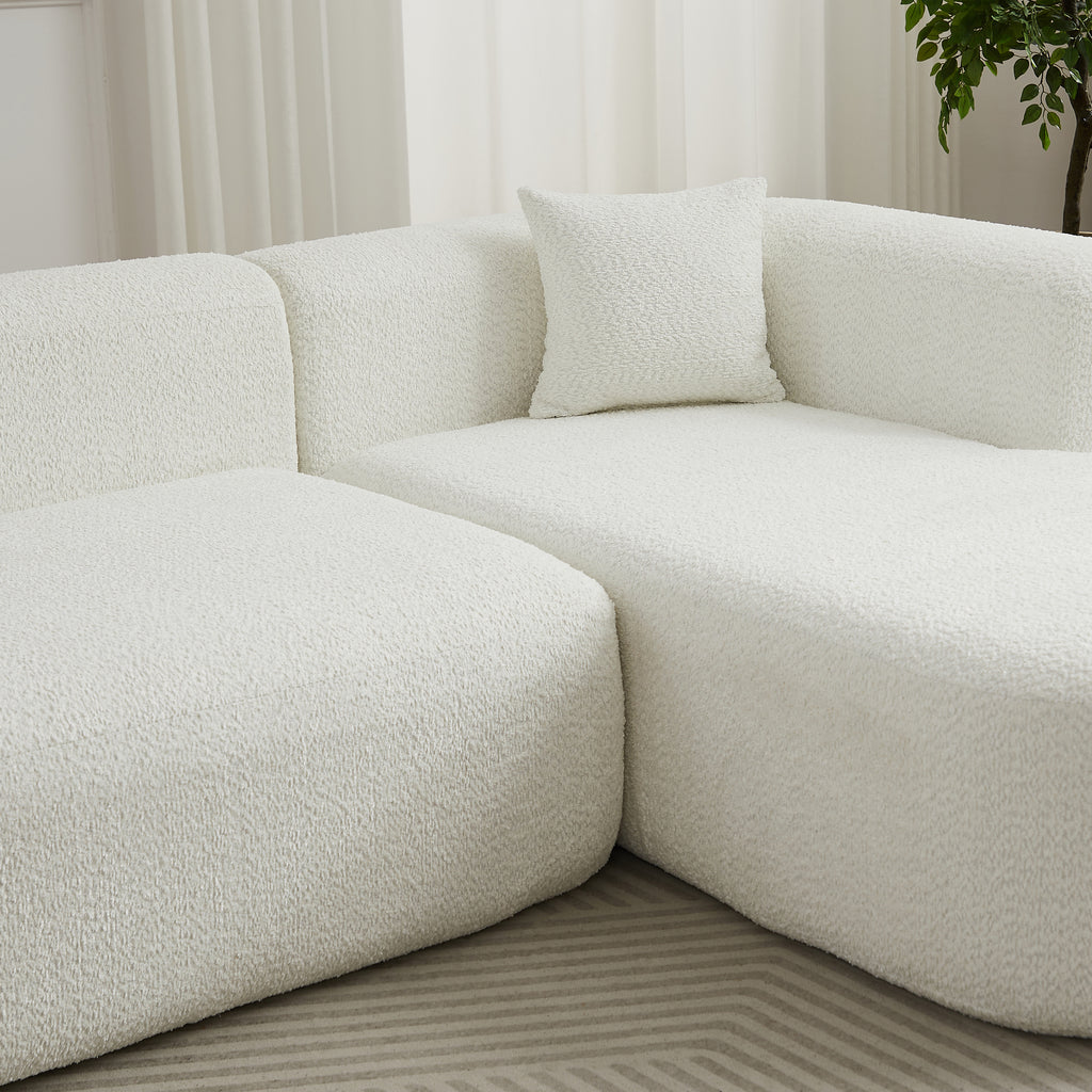 Close-up of the chenille fabric texture and plush cushions on the 109.4' modular sectional sofa in beige.