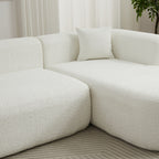 Close-up of the chenille fabric texture and plush cushions on the 109.4' modular sectional sofa in beige.