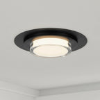 16 Inch LED Flush Mount Ceiling Fixture in black with integrated LED, installed on a white ceiling for modern ambient lighting.