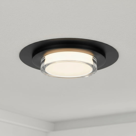 16 Inch LED Flush Mount Ceiling Fixture in black with integrated LED, installed on a white ceiling for modern ambient lighting.