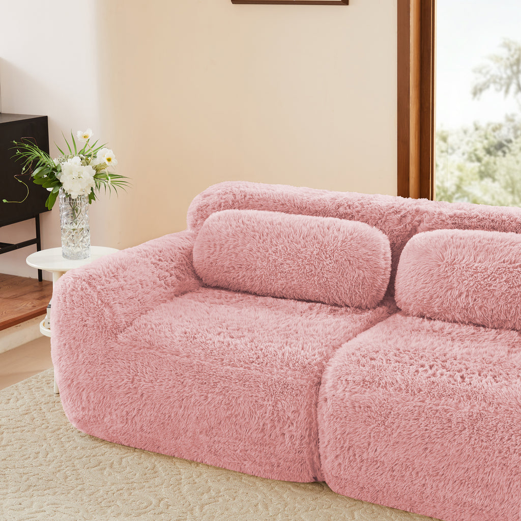 Side view of pink plush modular sofa with anti-slip base and ergonomic backrest, ideal for stylish and comfortable seating.