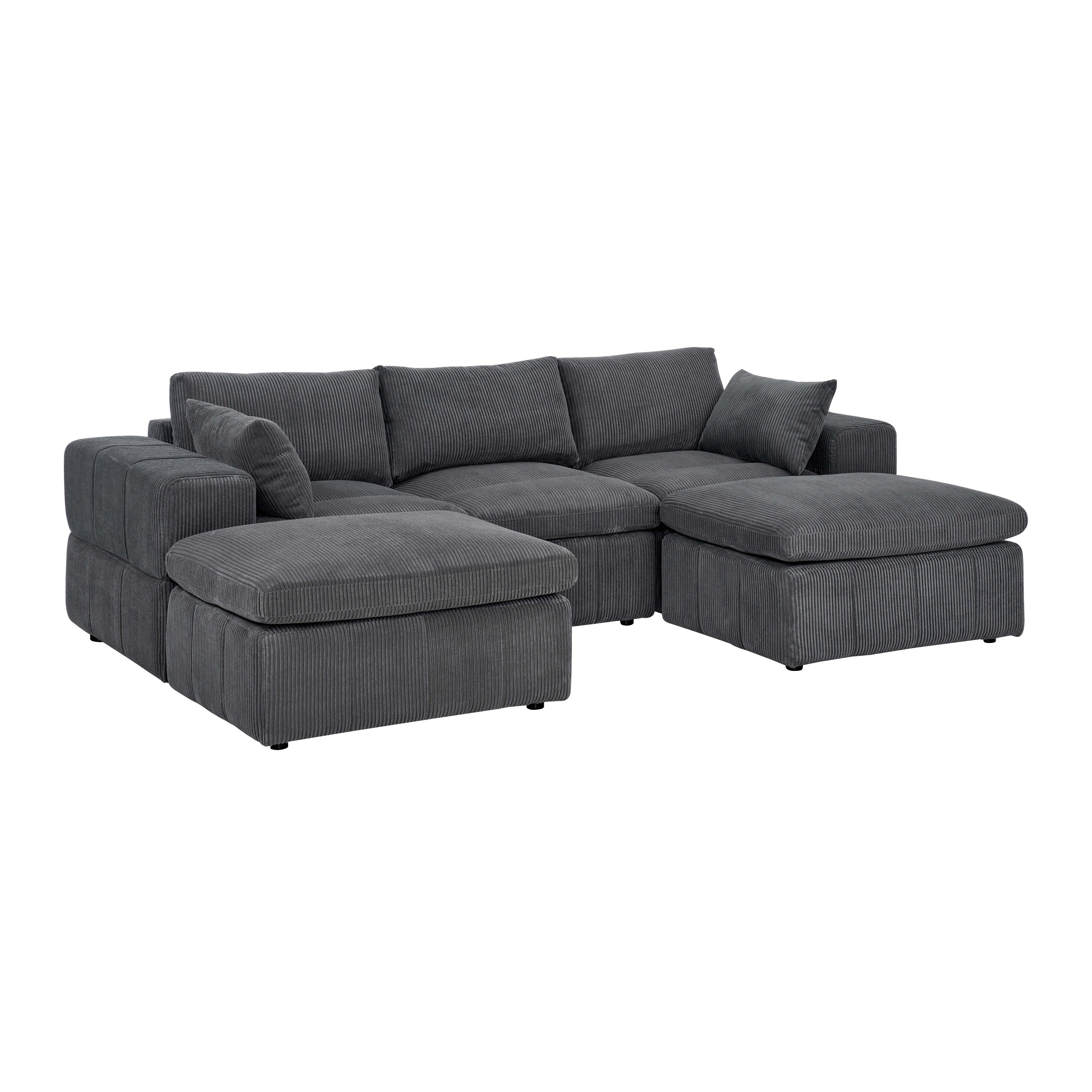 Angled view of modular sectional with ottomans in soft corduroy. Showcases large armrests and deep seating for comfort and style.