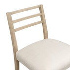 Close-up of ladder-style wooden backrest and upholstered seat, showcasing texture and build quality of the bar stool.