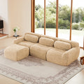 Plush fabric modular sectional sofa with ottoman in beige, featuring ergonomic design and no-leg base for modern living rooms.