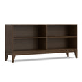 Mid-century modern low bookcase in walnut brown solid wood with four open storage compartments and tapered legs.