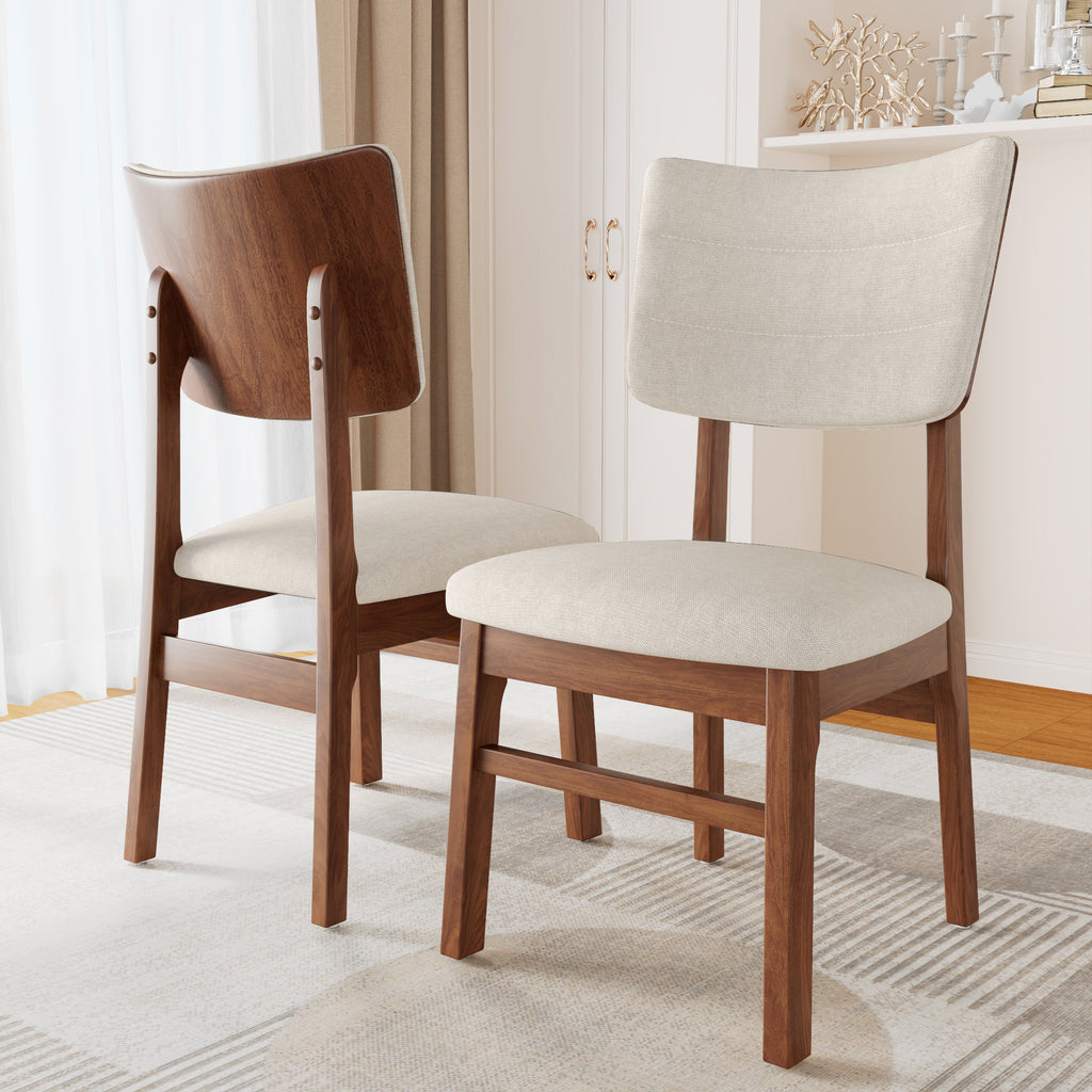 Pair of Mid-Century Modern Dining Chairs featuring curved wooden backs and cushioned beige seats on a light area rug.