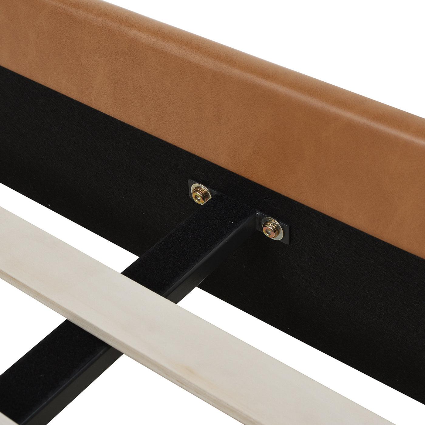 Detailed view of metal center support and bolt connection on Aspen king faux leather platform bed frame structure.
