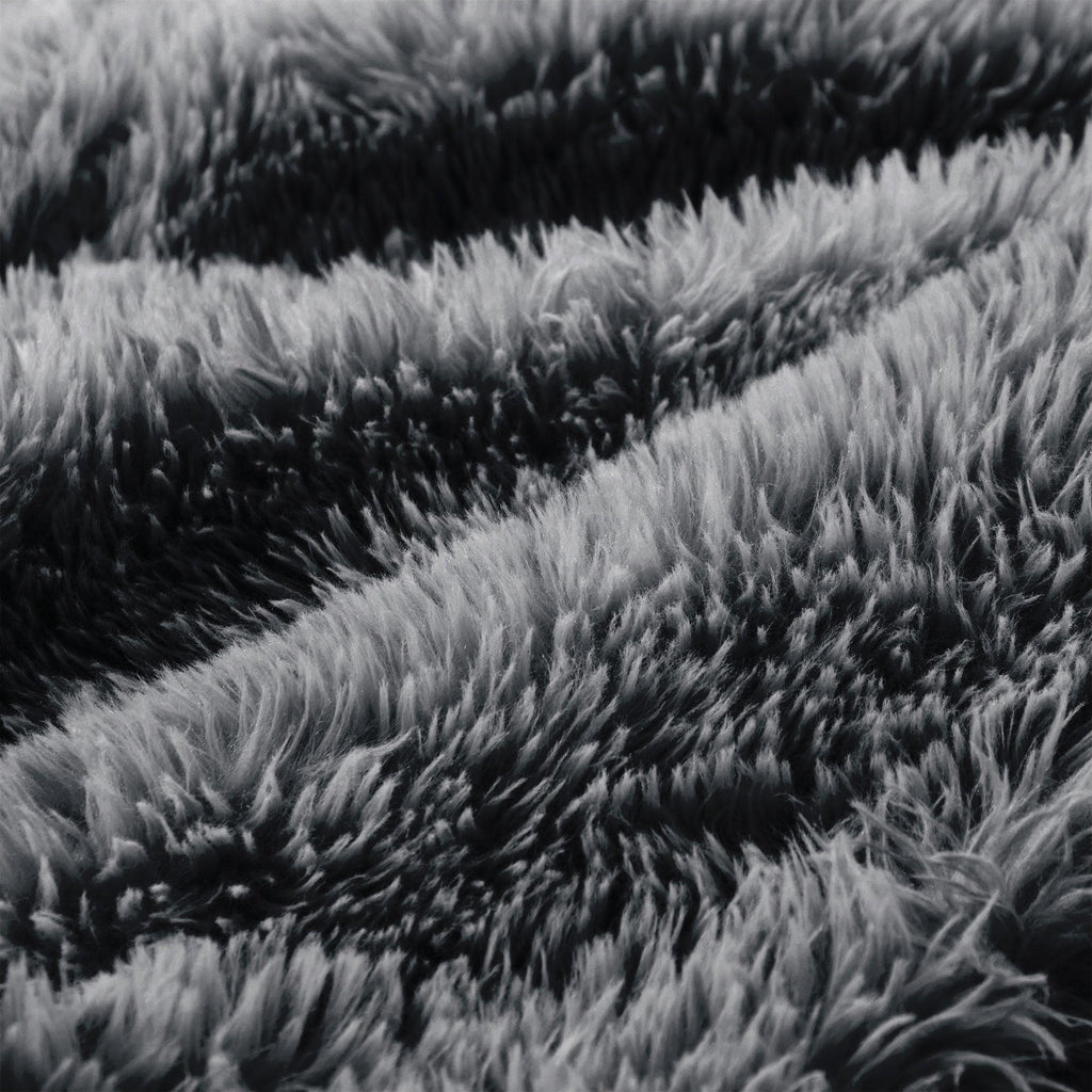 Detailed view of fluffy dark grey upholstery on Modular Plush Sofa. High-density sponge and plush fabric ensure premium comfort.