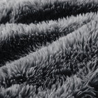 Detailed view of fluffy dark grey upholstery on Modular Plush Sofa. High-density sponge and plush fabric ensure premium comfort.