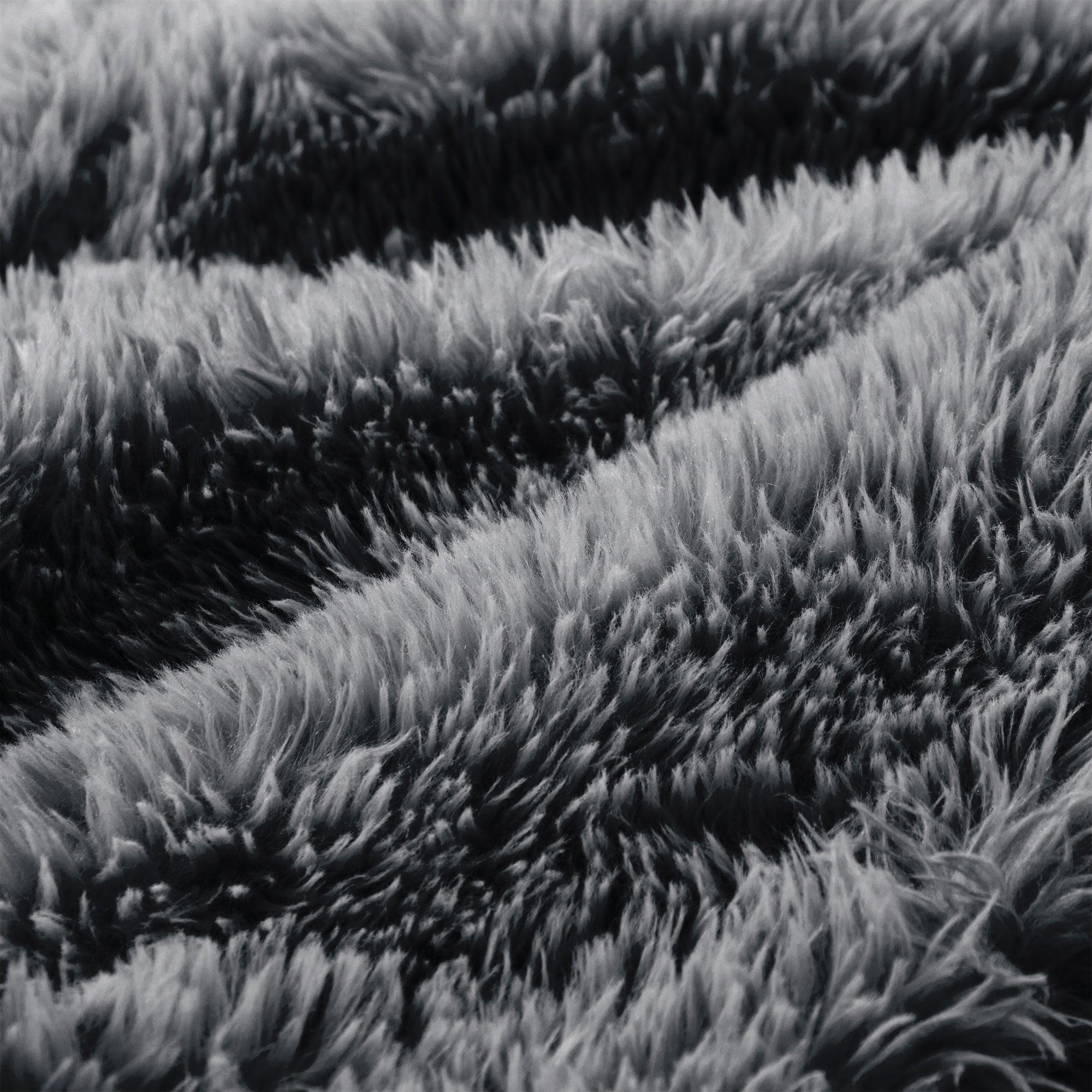 Detailed view of fluffy dark grey upholstery on Modular Plush Sofa. High-density sponge and plush fabric ensure premium comfort.