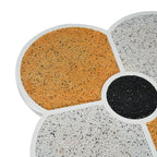 Detailed view of the terrazzo tabletop on the clover-shaped accent table, highlighting the textured gold and white segments.