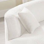 Detail of armrest and cushion on modern curved sofa set in white bouclé, showcasing cozy texture and refined craftsmanship.