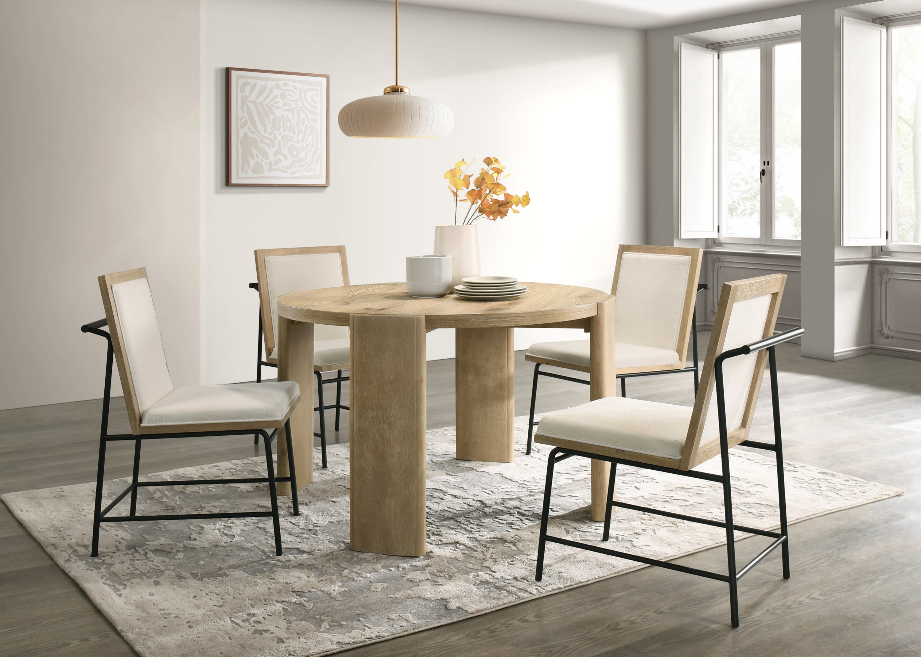 Bowen Oak Dining Table Set with Cream Upholstered Chairs in modern dining room. Solid oak round table seats 4, ideal for family meals.