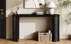 Front view of Mirod Console Table in black wood finish, placed against a neutral wall with decorative accents.