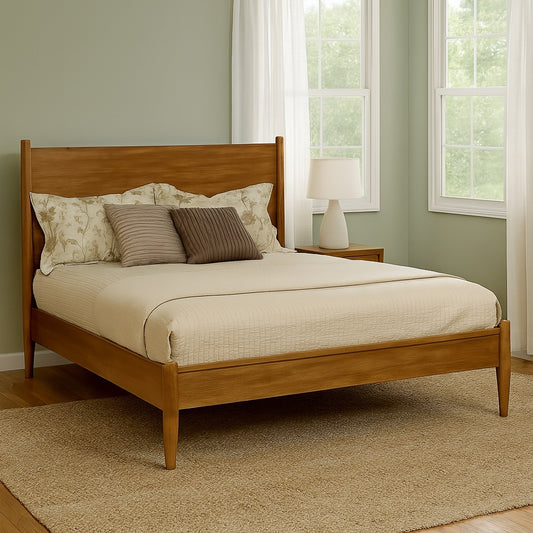 Mid-Century Modern Eastern King Wooden Platform Bed in Oak Finish placed in a sunlit bedroom, showcasing its warm tone and minimalist design.