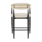 Rear view of modern counter stool with open-back gold frame and black iron legs for a contemporary look.